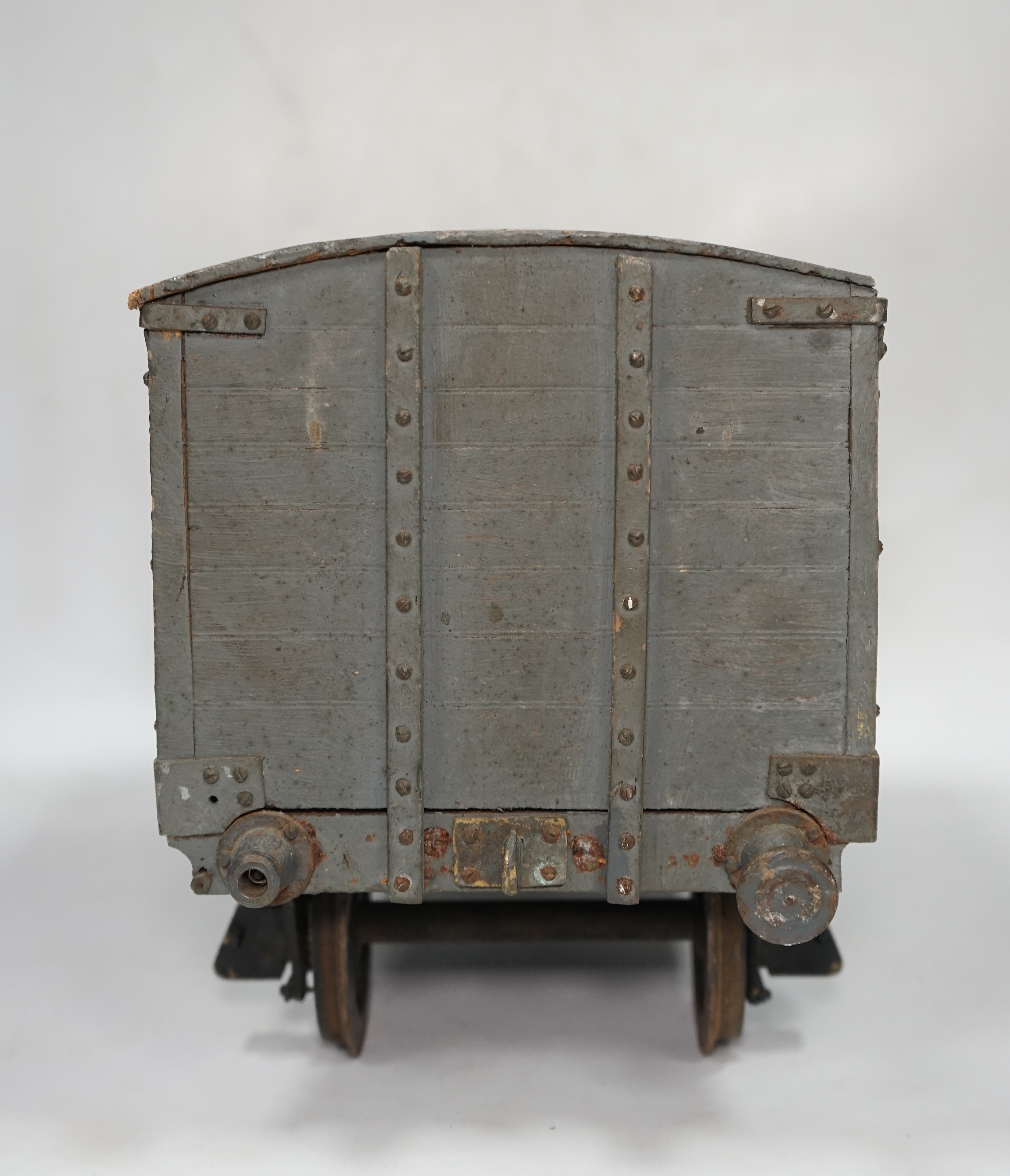 A 1950s/60s 3.5 inch gauge model railway box van, scratch built of plywood construction, with opening doors on both sides, 33cm long over the buffers, 18.5cm high. Condition - poor to fair, one buffer missing, springs mi